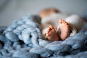 Feet of a newborn baby, unplanned but welcome option in Milwaukee